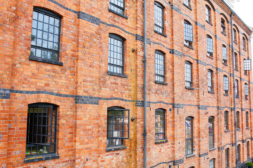 PRFD MG 4608 
 Alongside the Grand Union Cana 
 Keywords: 5 stories tall, Architecture, Canalside appartments, Historic, black windows, brick building, converted factory, converted warehouse, red brick, renovated