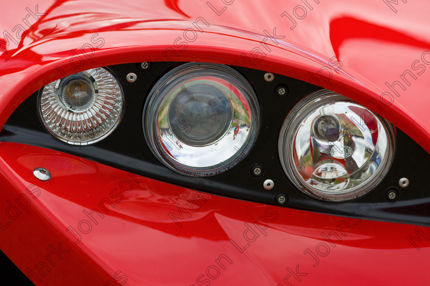 MG 1542-2 
 A set of 3 headlights mimicking the shape of a human eye. 
 Keywords: 3 lights, Mark Johnson LDPS, Red, driving, headlights, high dgloss red, illumination, johnson photographics, lights, safety, shape of an eye