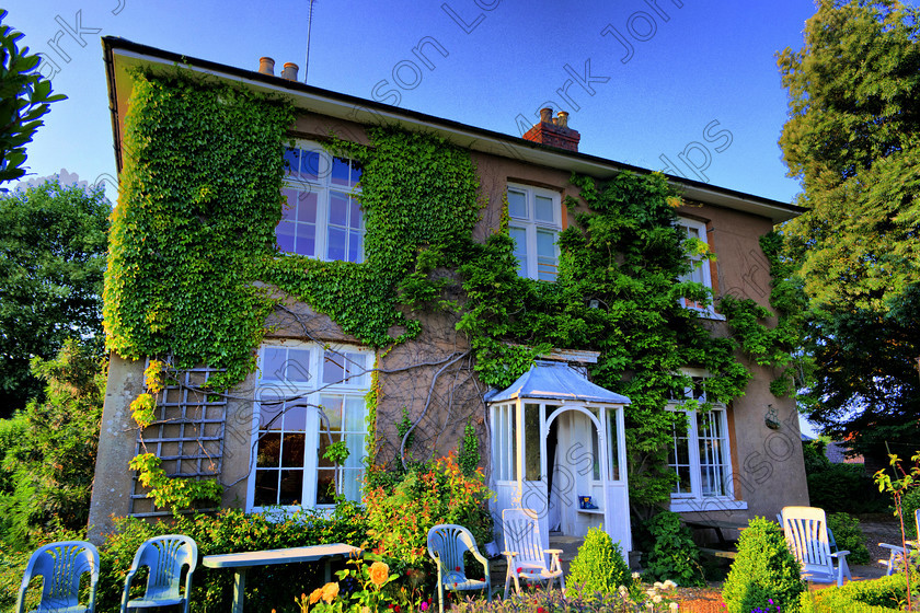 PrfdHDR SAM0500 
 in HDR. 
 Keywords: Blue sky, HDR, High Dynamic Range, Koinonia, community, country house, ivy, jesus army, rand house, trellis, vibrant, victorian, white porch, wisteria