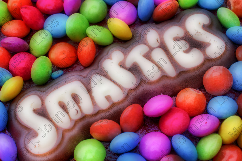 HDR Orton Smarties MG 2028 
 A cake made of Smarties with an Orton filter post capture 
 Keywords: Bracketed, Smarties, Sweets, birthday cake, bright, cake, chocolate, colourful, confectionary, filter, hdr, icing, orton, vibrant