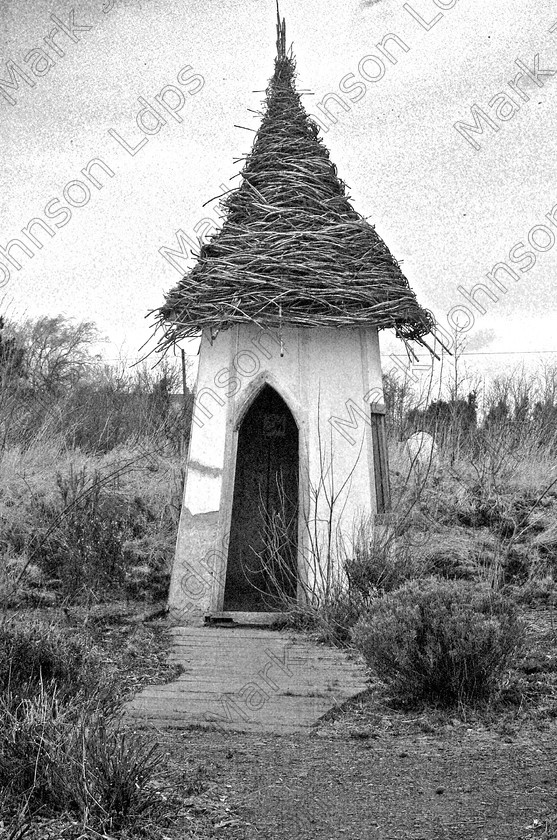 APS065 JP20050323rev230409 
 An image taken of a mud hut, i then adjusted via a levels adjustment layer, setting the highlights to bright white and the turned the levels layer to dissolve to get the look i wanted. 
 Keywords: MARK, JOHNSON, WINTER, TREES, BUILDING, THATCHED ROOF, STRAW ROOF, CONICLE, POINTED, WITCHES, WITCH, ROUND AND TALL, WHITE WASH
