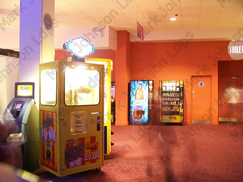 100 0390 
 Keywords: Mark Johnson, images, digital images, UK, GB, Great Britain, sixfields, bowling, ten pin bowling, amusements, free time, fun, spooky, ghosts at bowling alley, amusements, supernatural, poltergeist, image manipulation, vending machines, bright, colourful, orange